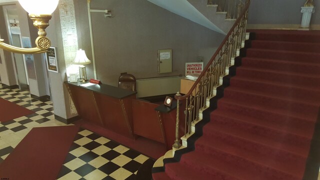 stairs with tile patterned floors
