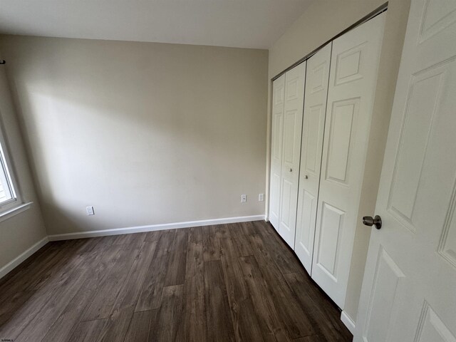 246 Heather Croft Unit 246, Egg Harbor Township, NJ 08234 - unfurnished bedroom with baseboards, dark wood-style floors, and a closet