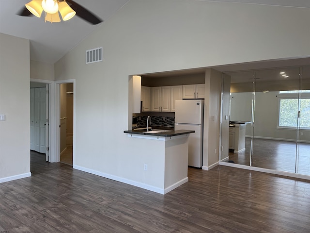 246 Heather Croft Unit 246, Egg Harbor Township, NJ 08234 - kitchen with dark countertops, visible vents, baseboards, freestanding refrigerator, and high vaulted ceiling