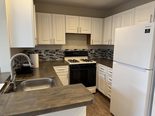 246 Heather Croft Unit 246, Egg Harbor Township, NJ 08234 - kitchen featuring wooden counters, a sink, freestanding refrigerator, black gas range, and white cabinetry