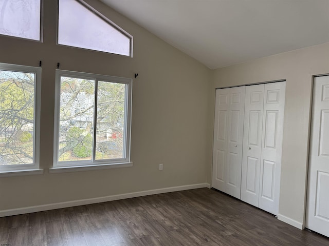 246 Heather Croft Unit 246, Egg Harbor Township, NJ 08234 - unfurnished bedroom with dark wood finished floors, lofted ceiling, multiple windows, and baseboards