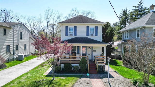 15 Elm Ave, Linwood, NJ 08221 - traditional style home featuring stairway, covered porch, roof with shingles, and central air condition unit