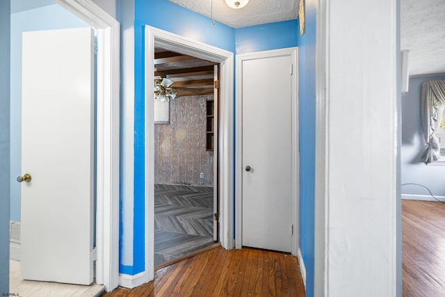 1139 Mcconnell Dr, Pleasantville, NJ 08232 - hall featuring baseboards, wood finished floors, and a textured ceiling