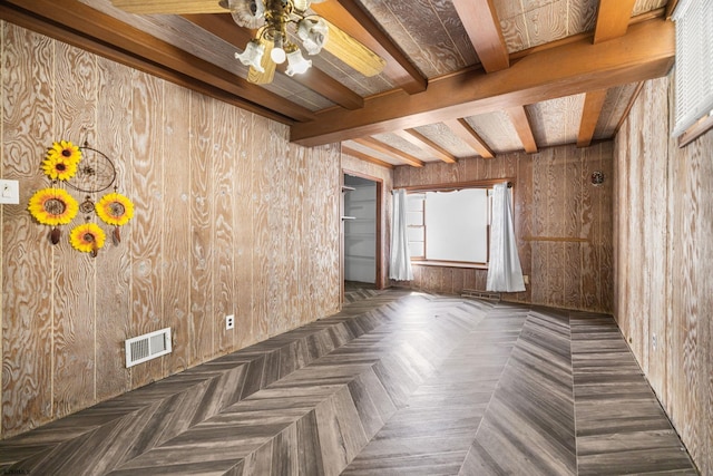 1139 Mcconnell Dr, Pleasantville, NJ 08232 - spare room with wood walls, beamed ceiling, visible vents, and ceiling fan