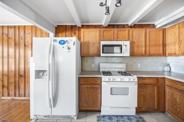 1139 Mcconnell Dr, Pleasantville, NJ 08232 - kitchen featuring beamed ceiling, light countertops, white appliances, and backsplash