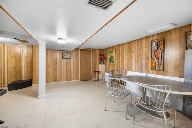 1139 Mcconnell Dr, Pleasantville, NJ 08232 - dining area featuring visible vents, tile patterned floors, and wooden walls