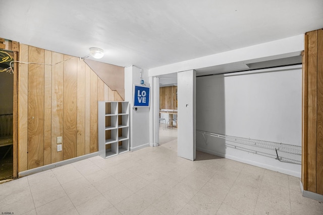 1139 Mcconnell Dr, Pleasantville, NJ 08232 - finished below grade area with tile patterned floors, baseboards, and wood walls