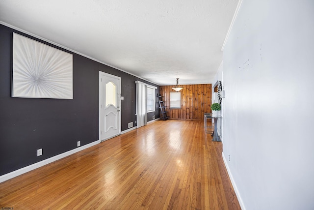 1139 Mcconnell Dr, Pleasantville, NJ 08232 - unfurnished living room featuring hardwood / wood-style flooring, baseboards, and crown molding
