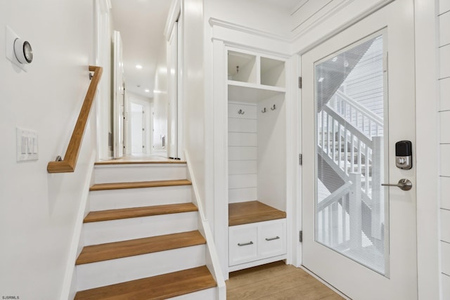 mudroom with light wood-style floors