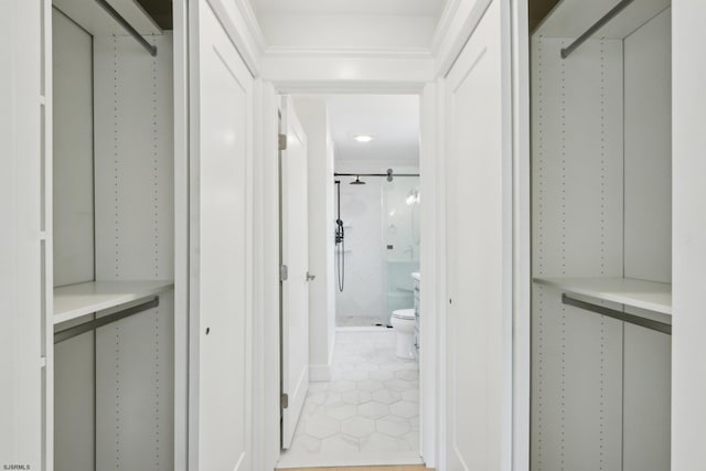 spacious closet featuring light tile patterned floors