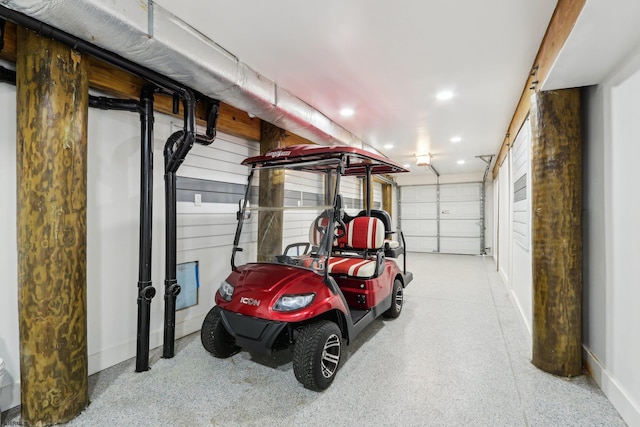 garage featuring baseboards and recessed lighting