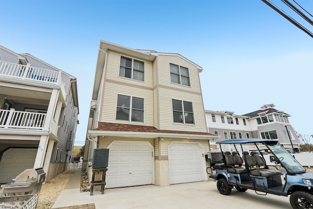 view of front of property featuring an attached garage and concrete driveway