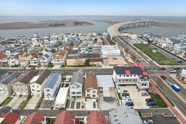 bird's eye view with a residential view and a water view