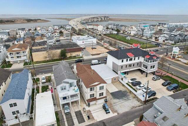 birds eye view of property featuring a residential view and a water view