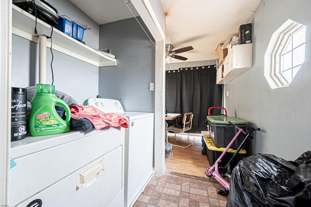 washroom with brick patterned floor, washing machine and clothes dryer, a ceiling fan, and laundry area