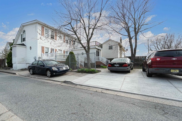 view of street featuring a residential view, sidewalks, and curbs