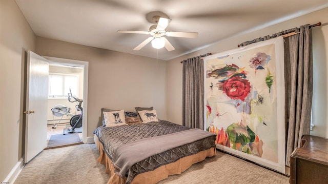 carpeted bedroom featuring ceiling fan and baseboards