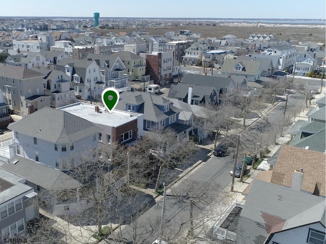 birds eye view of property with a residential view