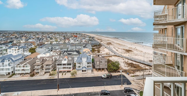 aerial view featuring a view of the beach and a water view