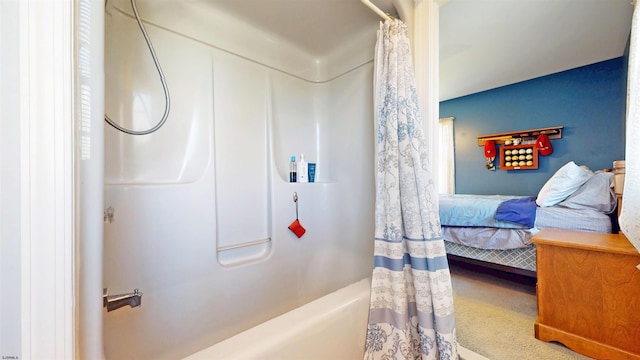 bathroom featuring shower / tub combo and ensuite bath
