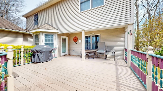 wooden terrace featuring grilling area