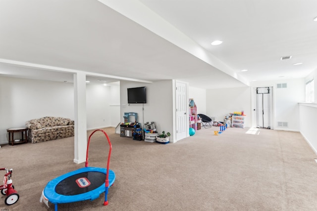 playroom with carpet, visible vents, and baseboards