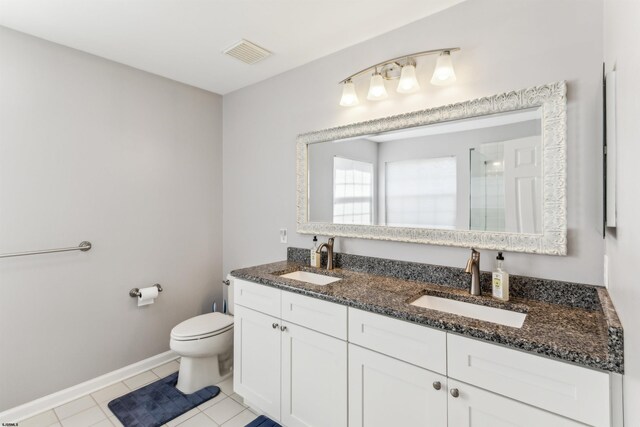 full bathroom with visible vents, a sink, a shower, and toilet