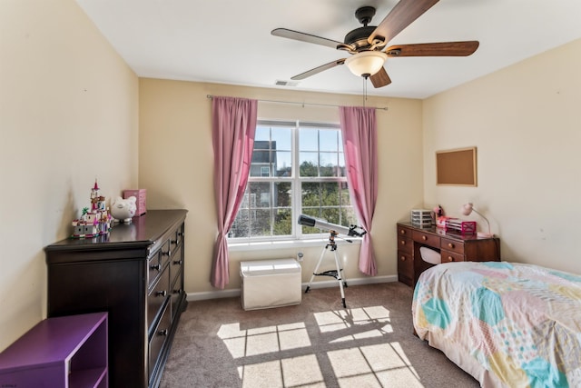bedroom with baseboards, visible vents, and light colored carpet