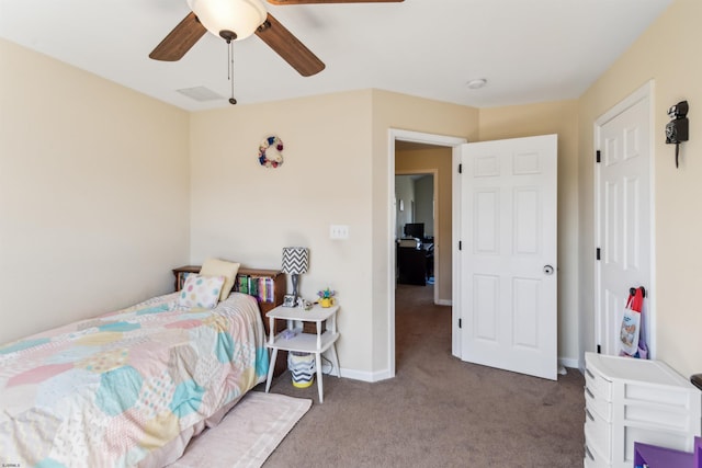 carpeted bedroom featuring visible vents, baseboards, and ceiling fan