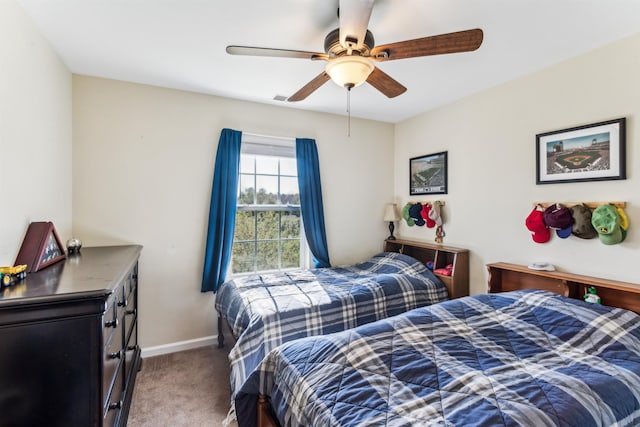 bedroom with carpet flooring, baseboards, and ceiling fan