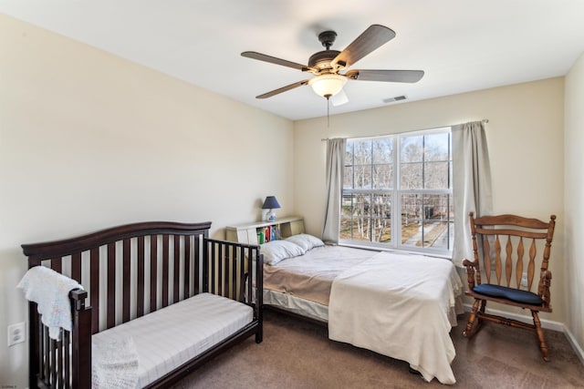 bedroom with visible vents, carpet flooring, baseboards, and ceiling fan