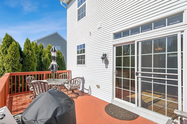 wooden deck with outdoor dining area