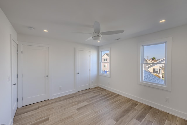 unfurnished bedroom with recessed lighting, light wood finished floors, baseboards, and ceiling fan