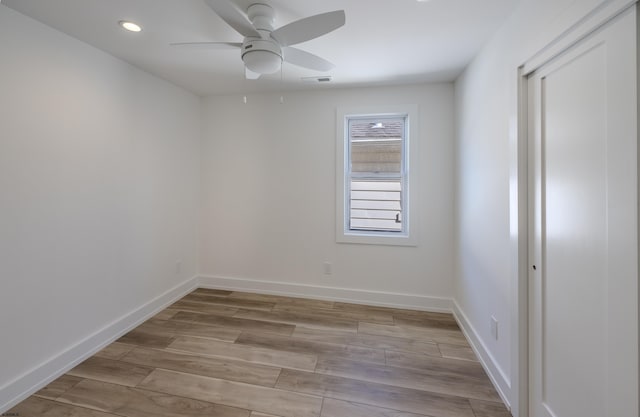 unfurnished room with light wood-type flooring, ceiling fan, baseboards, visible vents, and recessed lighting