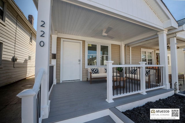 entrance to property featuring a porch, a ceiling fan, and board and batten siding