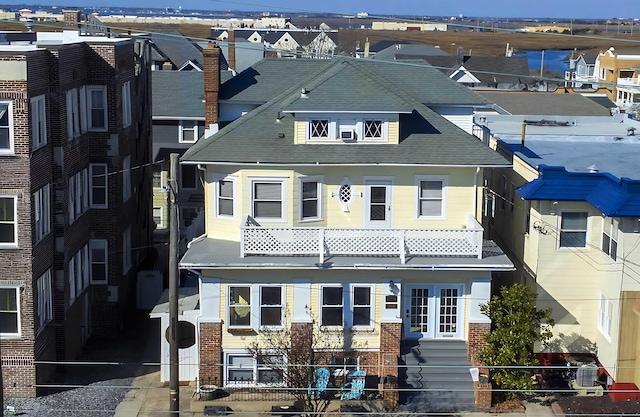 5003 Ventnor Ave, Ventnor, NJ 08406 - view of front of home featuring brick siding, cooling unit, and a shingled roof