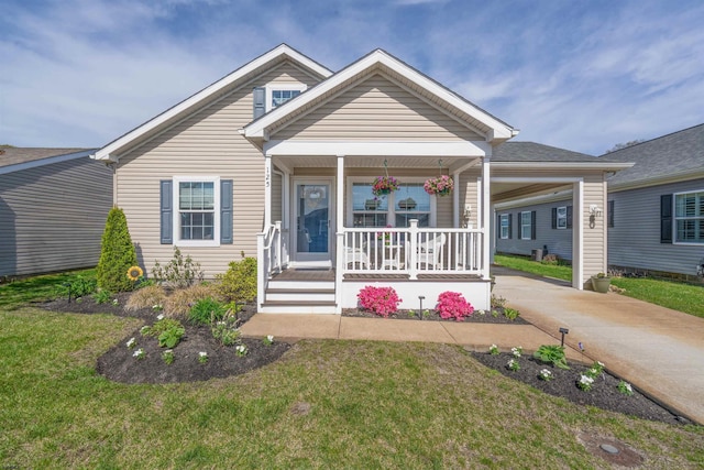 bungalow-style house with a porch, a front lawn, and concrete driveway