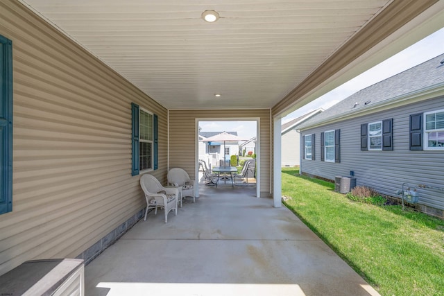 view of patio / terrace with outdoor dining area and central AC