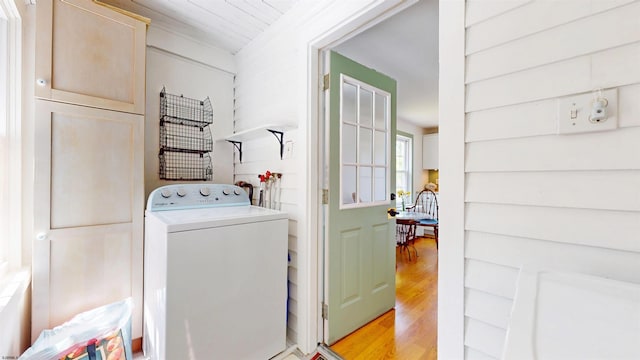 washroom featuring light wood finished floors, laundry area, and washer / dryer