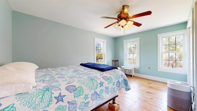 27 Smith Bowen, Galloway Township, NJ 08205 - bedroom featuring ceiling fan, baseboards, radiator heating unit, and light wood-style flooring