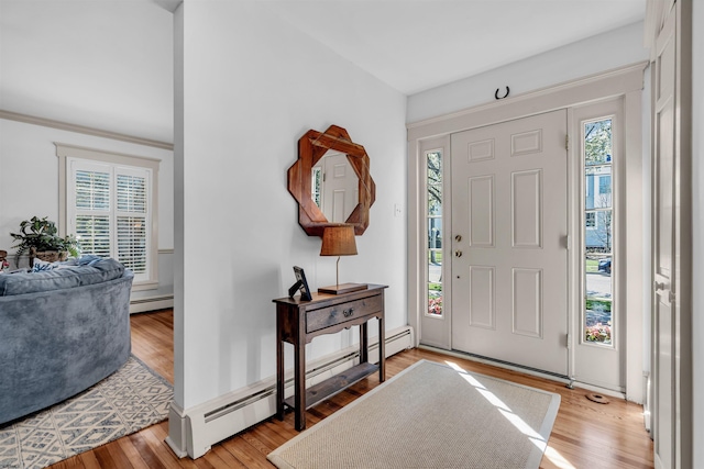 336 E Seabright Rd, Ocean City, NJ 08226 - foyer with light wood-type flooring, a baseboard radiator, and a healthy amount of sunlight