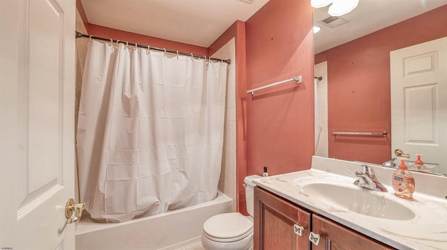 bathroom featuring shower / bath combo, visible vents, vanity, and toilet