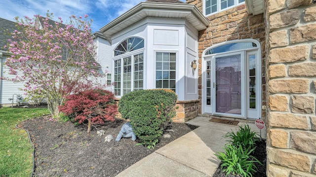 view of exterior entry with stone siding