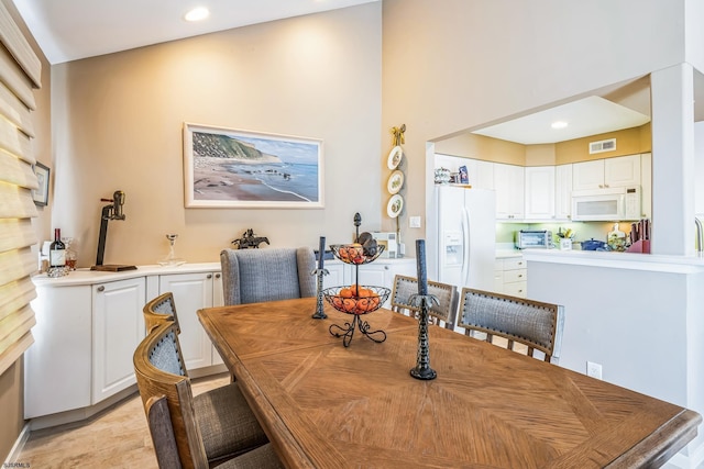 dining room featuring a toaster, visible vents, and recessed lighting