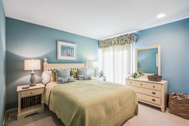 bedroom with light carpet