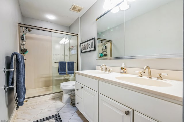 bathroom featuring a stall shower, double vanity, a sink, and visible vents