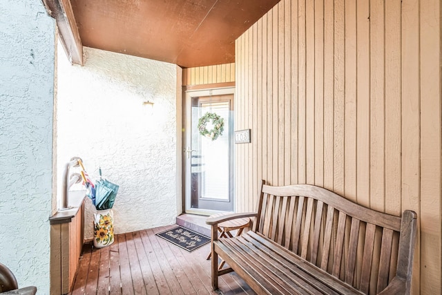 entrance to property with stucco siding