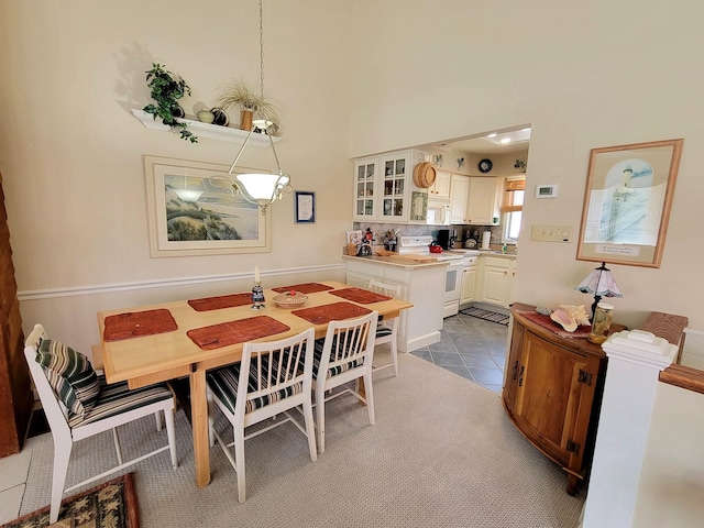 305 57th St Unit 305, Ocean City, NJ 08226 - tiled dining area featuring a towering ceiling