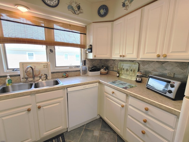 305 57th St Unit 305, Ocean City, NJ 08226 - kitchen with backsplash, white cabinetry, dishwasher, and a sink