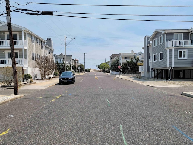 305 57th St Unit 305, Ocean City, NJ 08226 - view of street featuring curbs, sidewalks, a residential view, and traffic signs